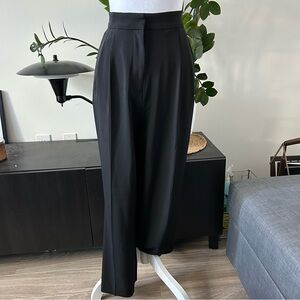 Black pleated trousers